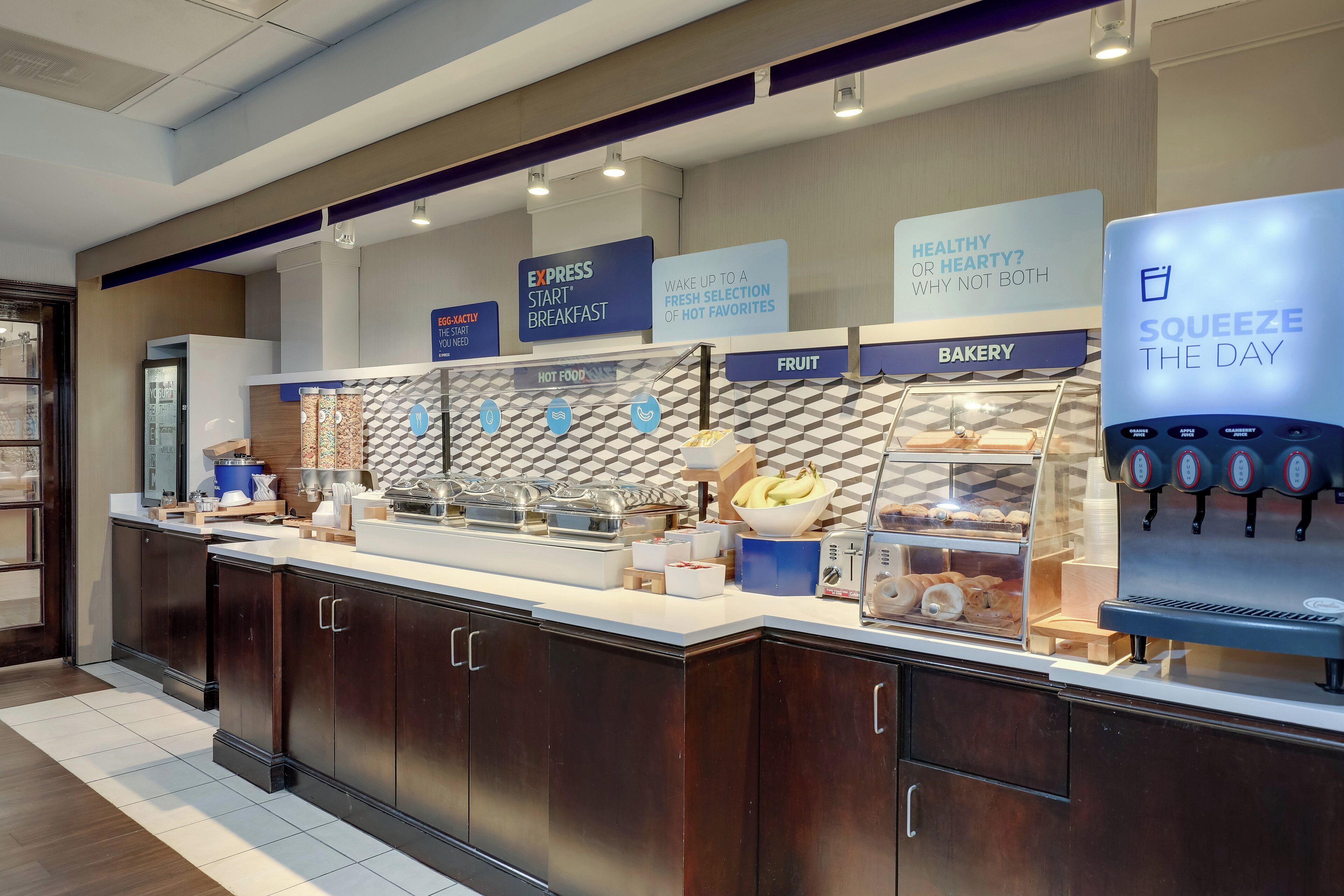 A breakfast bar with a sign reading "Express Start Breakfast" and another sign stating "Healthy or Hearty? Why not both."