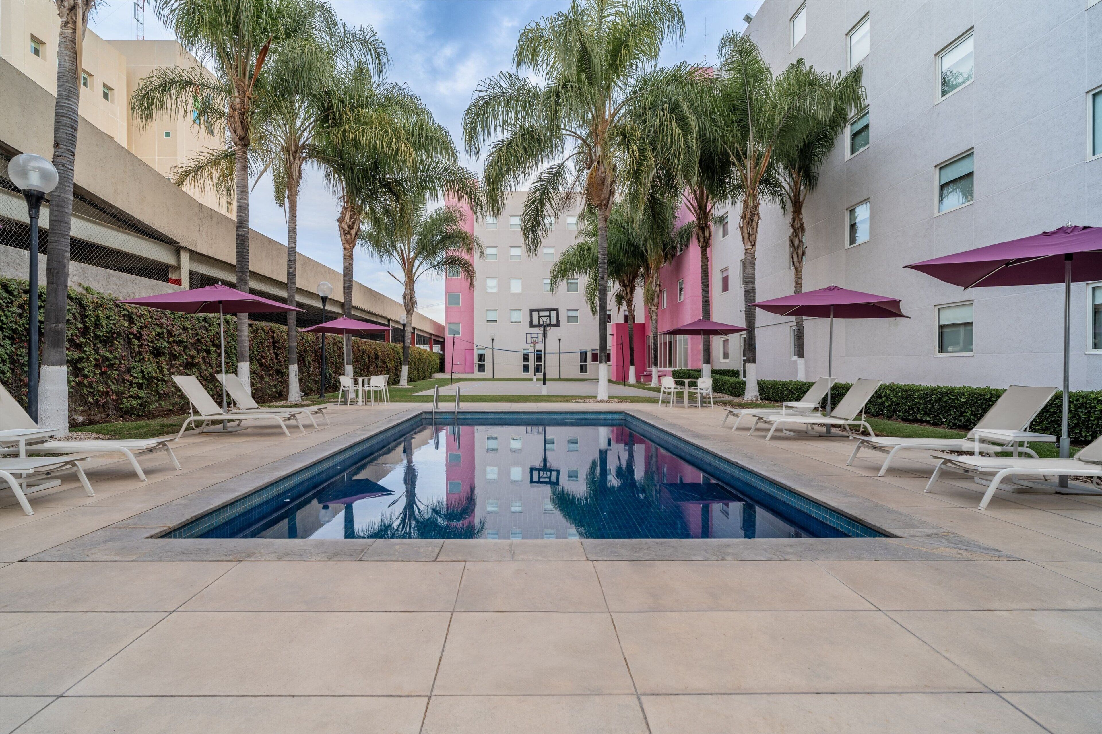 outdoor pool, open 8 am to 8 pm, pool loungers