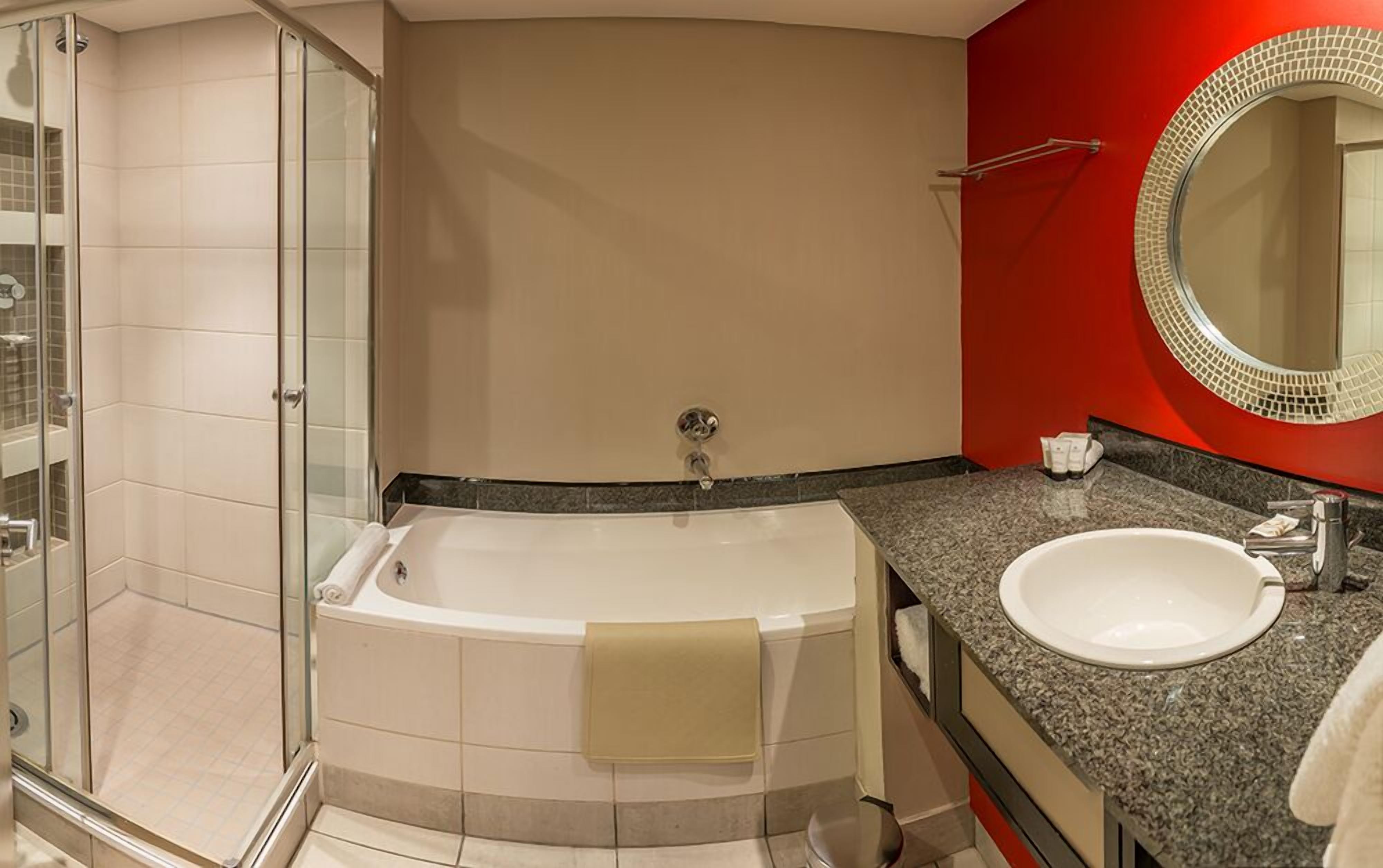 separate bathtub and shower, designer toiletries, hair dryer, towels