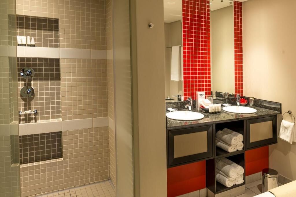 superior twin room | bathroom | separate bathtub and shower, designer toiletries, hair dryer, towels