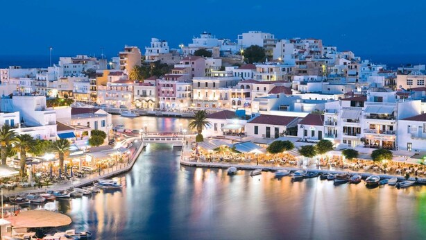 A coastal town with a marina, waterfront cafes, and buildings with balconies. - Creta Suites (Ierapetra)