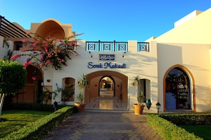 A building with a sign reading "Souk Makadi" and an arched entrance. - JAZ Makadi Saraya Resort - All inclusive (Makadi Bay)