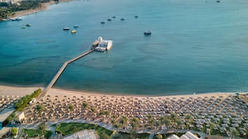 Sun-loungers, beach towels, beach volleyball, beach bar