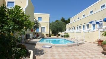 Outdoor pool, pool umbrellas, pool loungers