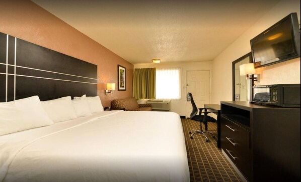 Tabla de planchar con plancha, wifi gratis y ropa de cama 