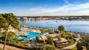 Indoor pool, seasonal outdoor pool, pool umbrellas, pool loungers