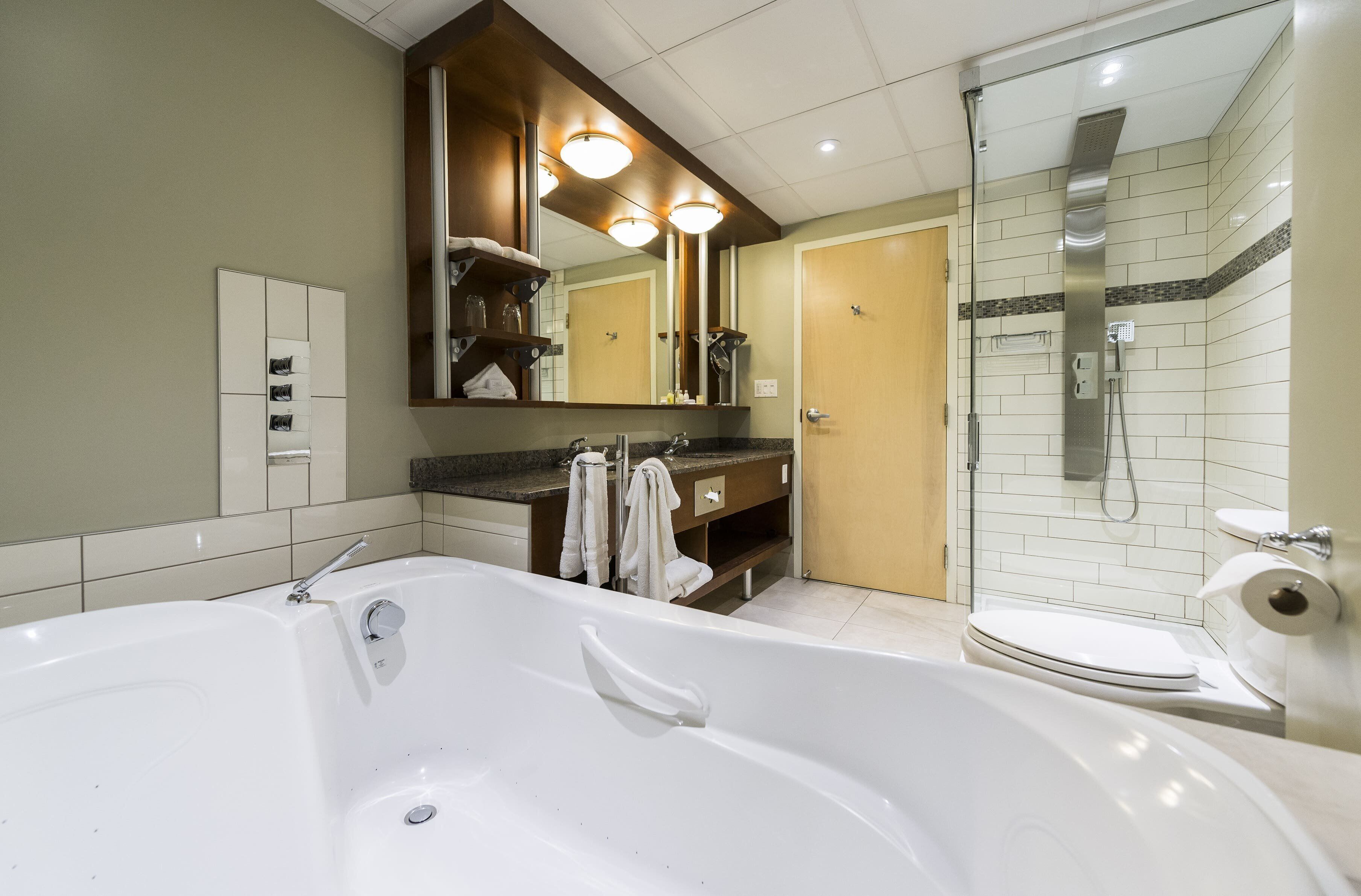 suite, 1 king bed | bathroom | free toiletries, hair dryer, towels, soap