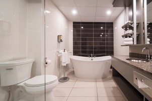 Suite, 1 King Bed | Bathroom | Free toiletries, hair dryer, towels, soap