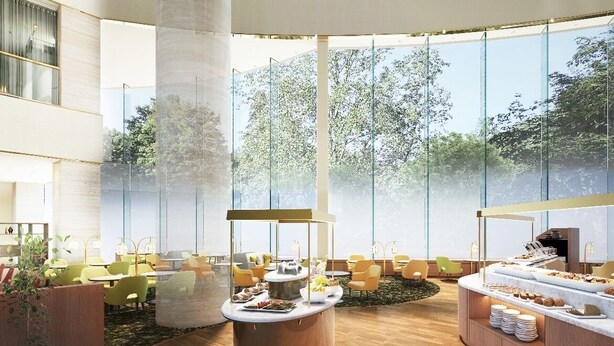 Un espace intérieur spacieux avec une table ronde centrale entourée de sièges, de grandes fenêtres et un buffet.