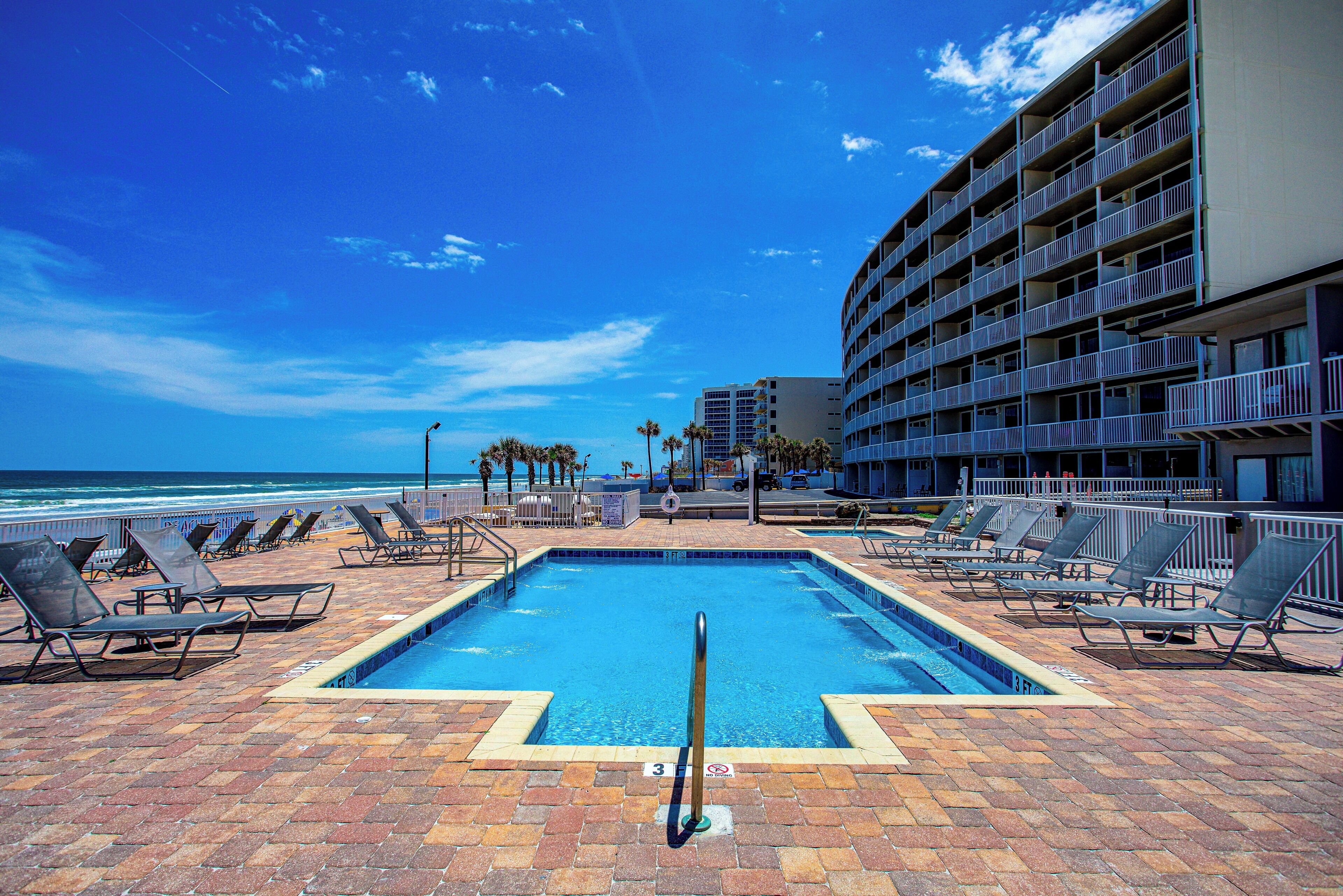 Outdoor pool, open 8:00 AM to 8:00 PM, pool umbrellas, pool loungers