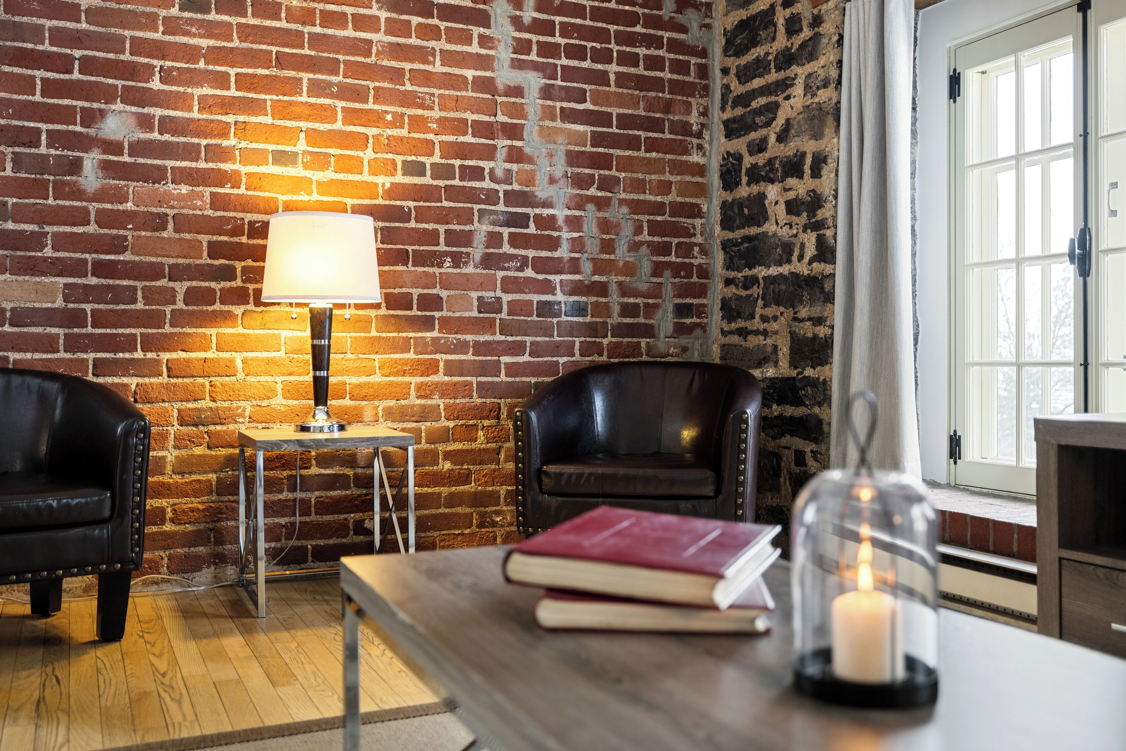 superior suite, 1 king bed with 1 queen murphy bed (no pet allowed) | living area | flat-screen tv, heated floors