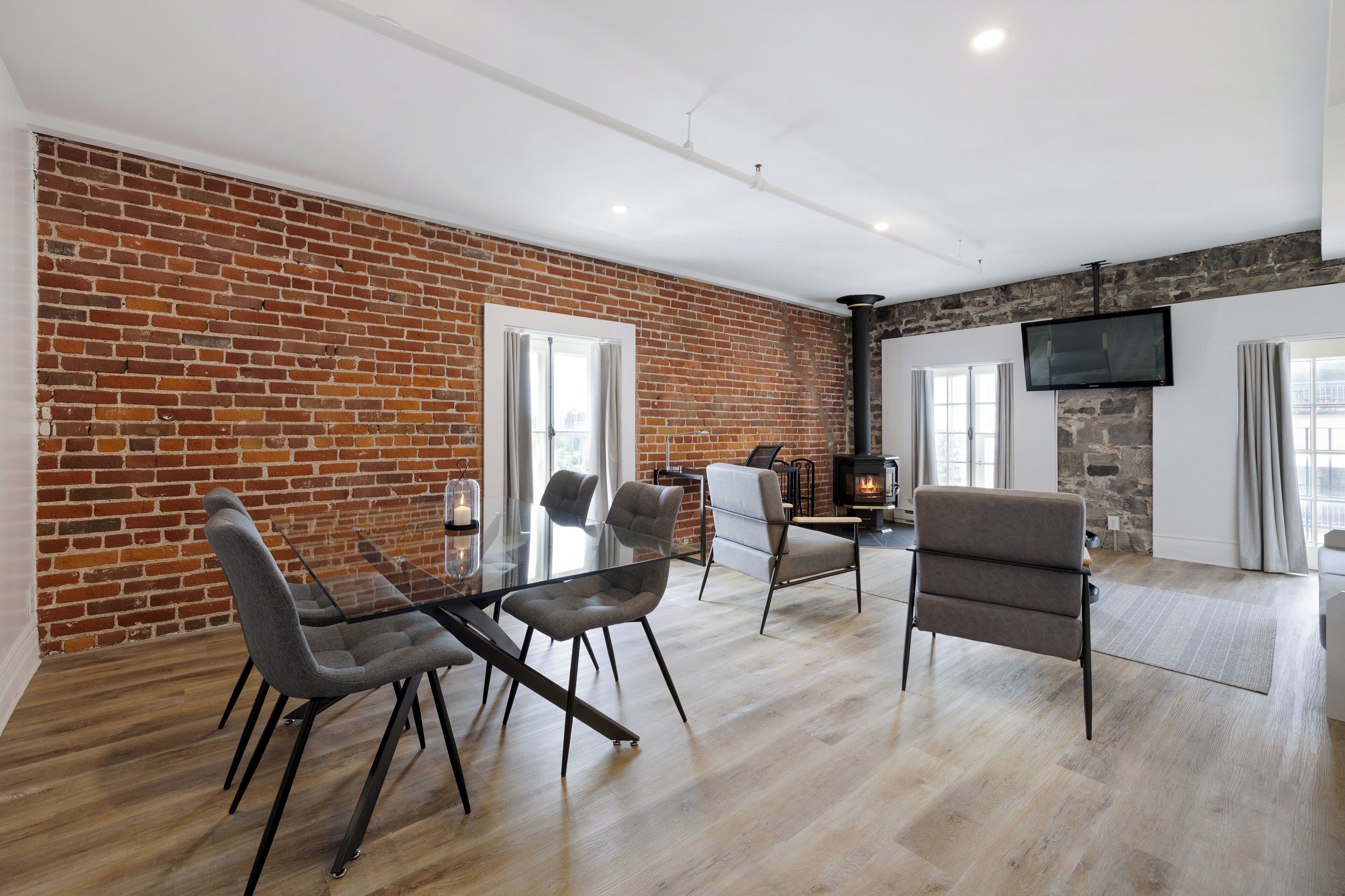 superior suite, 1 king bed with 1 queen murphy bed (no pet allowed) | living area | flat-screen tv, heated floors