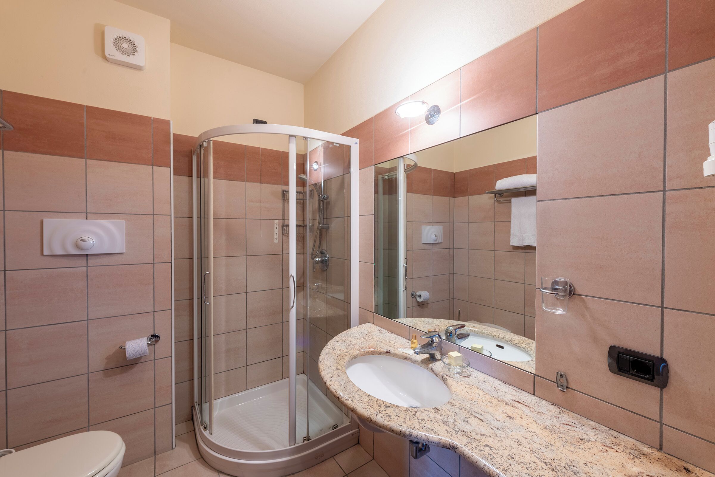 superior double room | bathroom | shower, hair dryer, slippers, towels