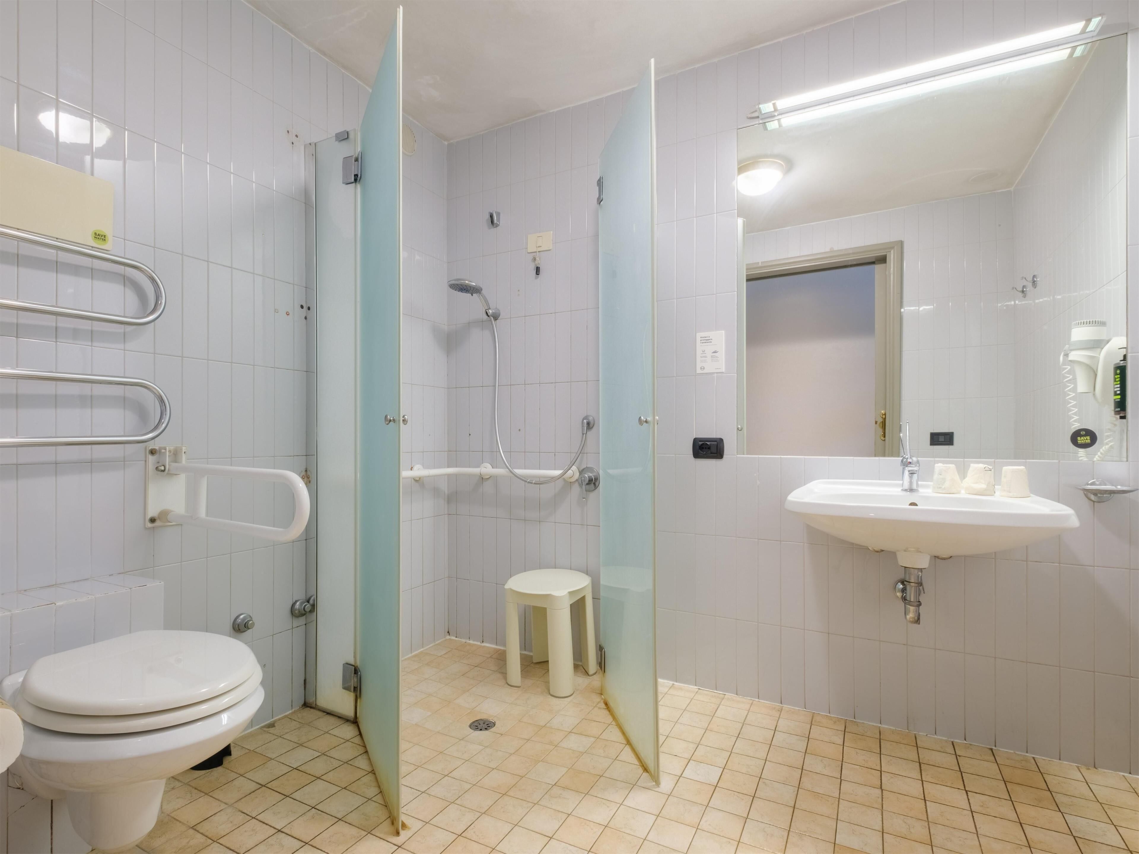 shower, hair dryer, bidet, towels