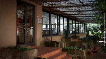 Breakfast, lunch, dinner served; Italian cuisine, garden views