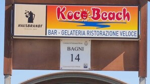 A beach bar named Koco Beach with a sign indicating it is number 14 on the beach. - Hotel Touring Falconara Marittima (Falconara Marittima)