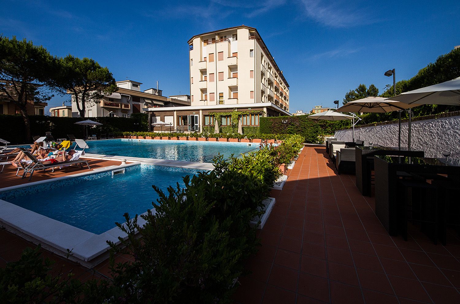 Seasonal outdoor pool, pool umbrellas, pool loungers