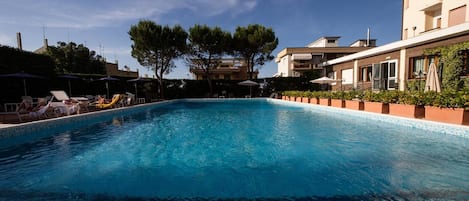 Seasonal outdoor pool, pool umbrellas, sun loungers