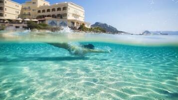 Private beach, white sand, sun loungers, beach umbrellas