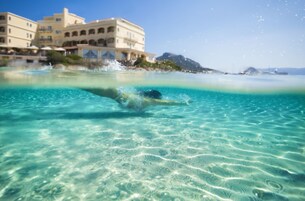 Private beach, white sand, sun loungers, beach umbrellas