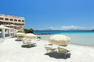 Private beach, white sand, sun loungers, beach umbrellas