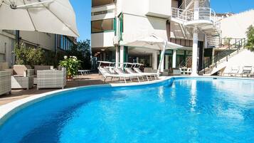Seasonal outdoor pool, pool umbrellas, sun loungers