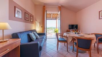 Standard Apartment, 2 Bedrooms | Living area | 32-inch TV with digital channels