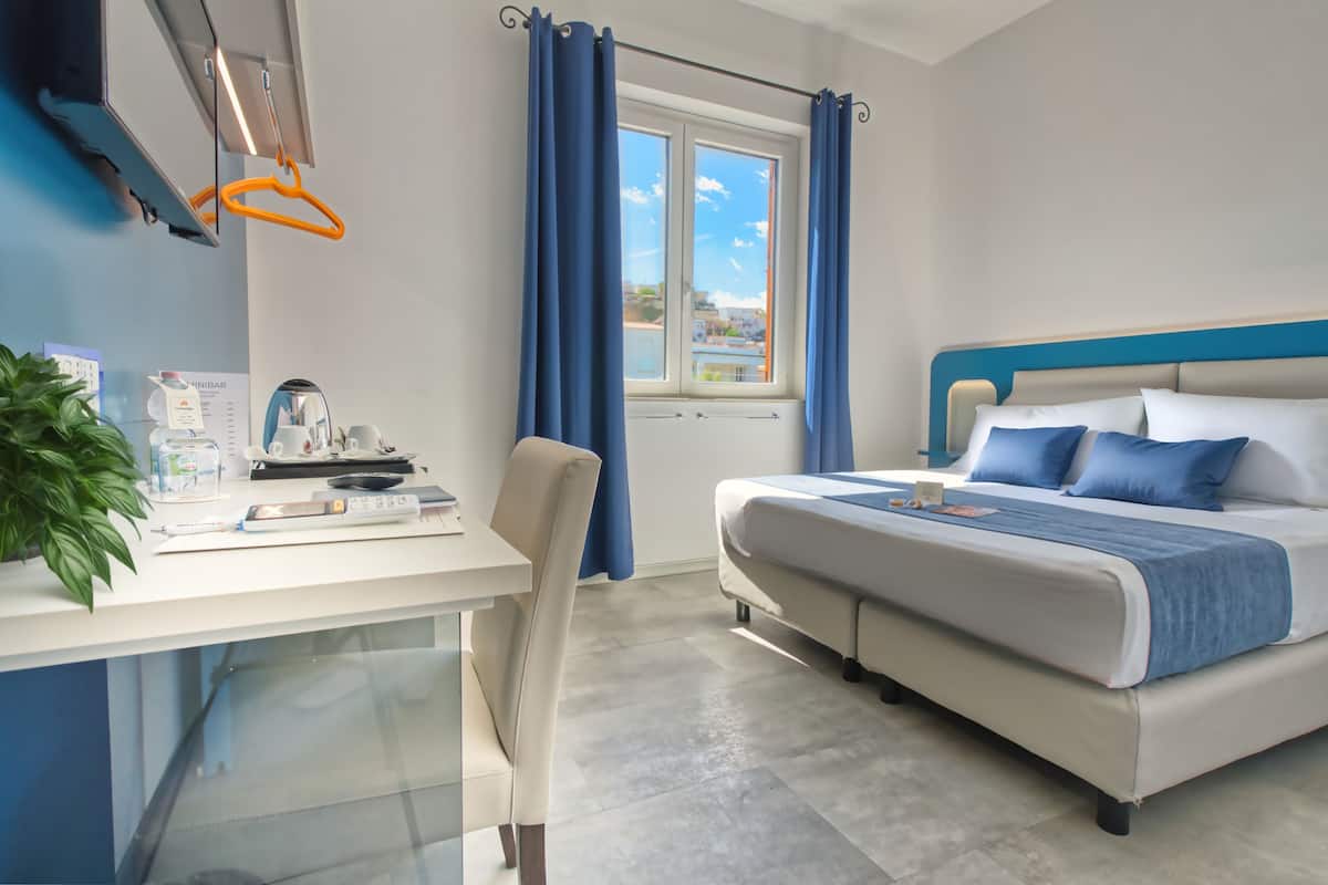 Standaard kamer, 1 twee- of 2 eenpersoonsbedden, uitzicht op tuin | Een minibar, een kluis op de kamer, individueel gedecoreerd