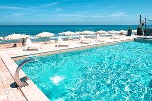 Outdoor pool, pool umbrellas, pool loungers