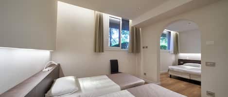 Premium Family Room | Minibar, in-room safe, desk, laptop workspace