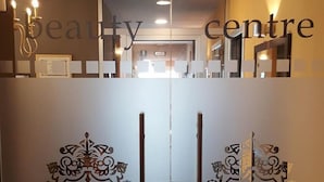 A double door with a logo and a light switch in the center. - Hotel Greif (Lignano Sabbiadoro)