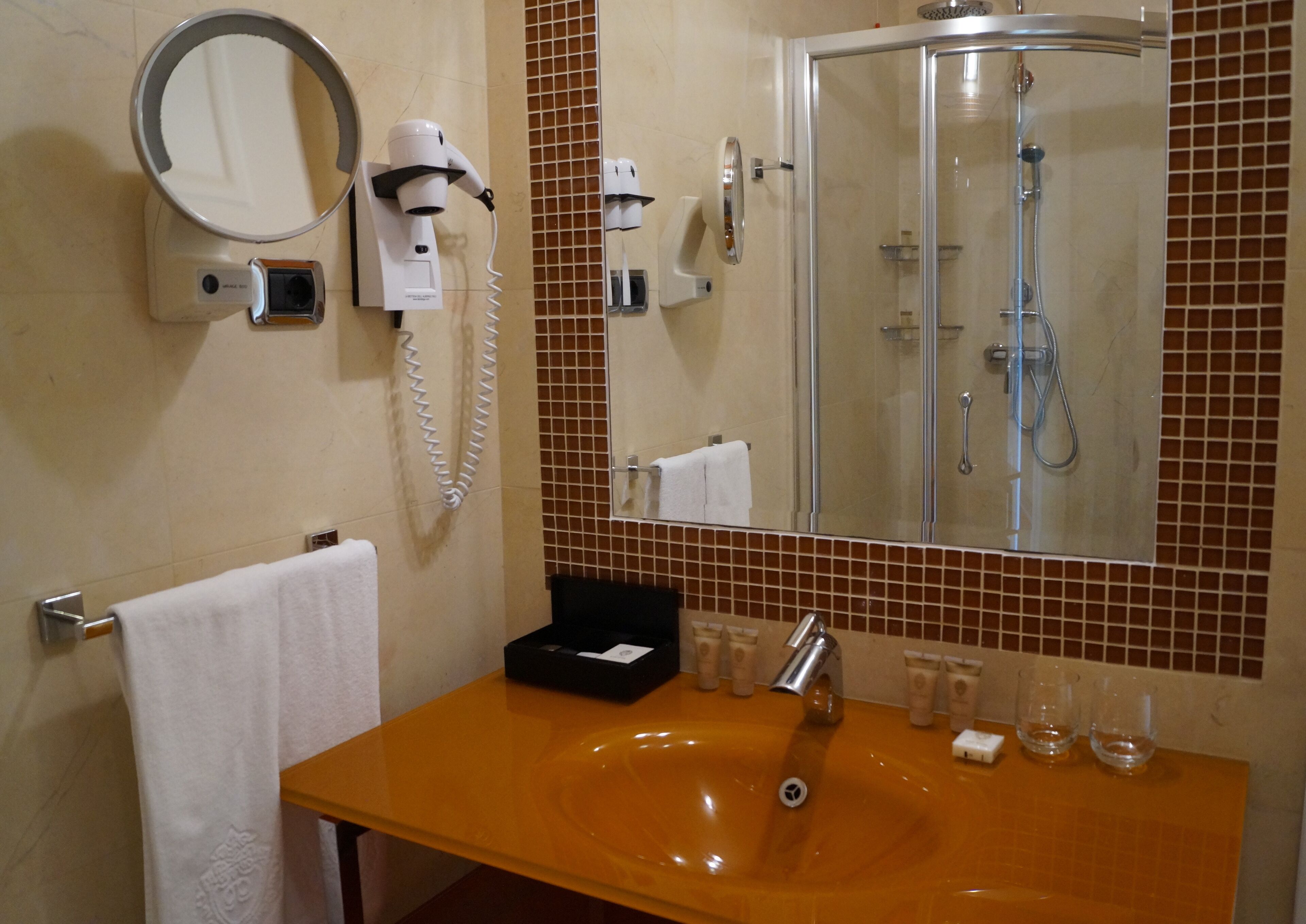 deluxe family suite | bathroom | hair dryer, bathrobes, slippers, towels