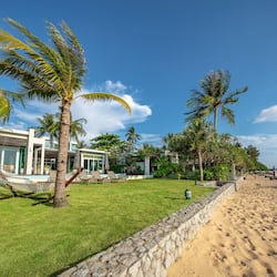 Enjoy a beachfront stay with a lawn, pool, and access to the sandy beach.