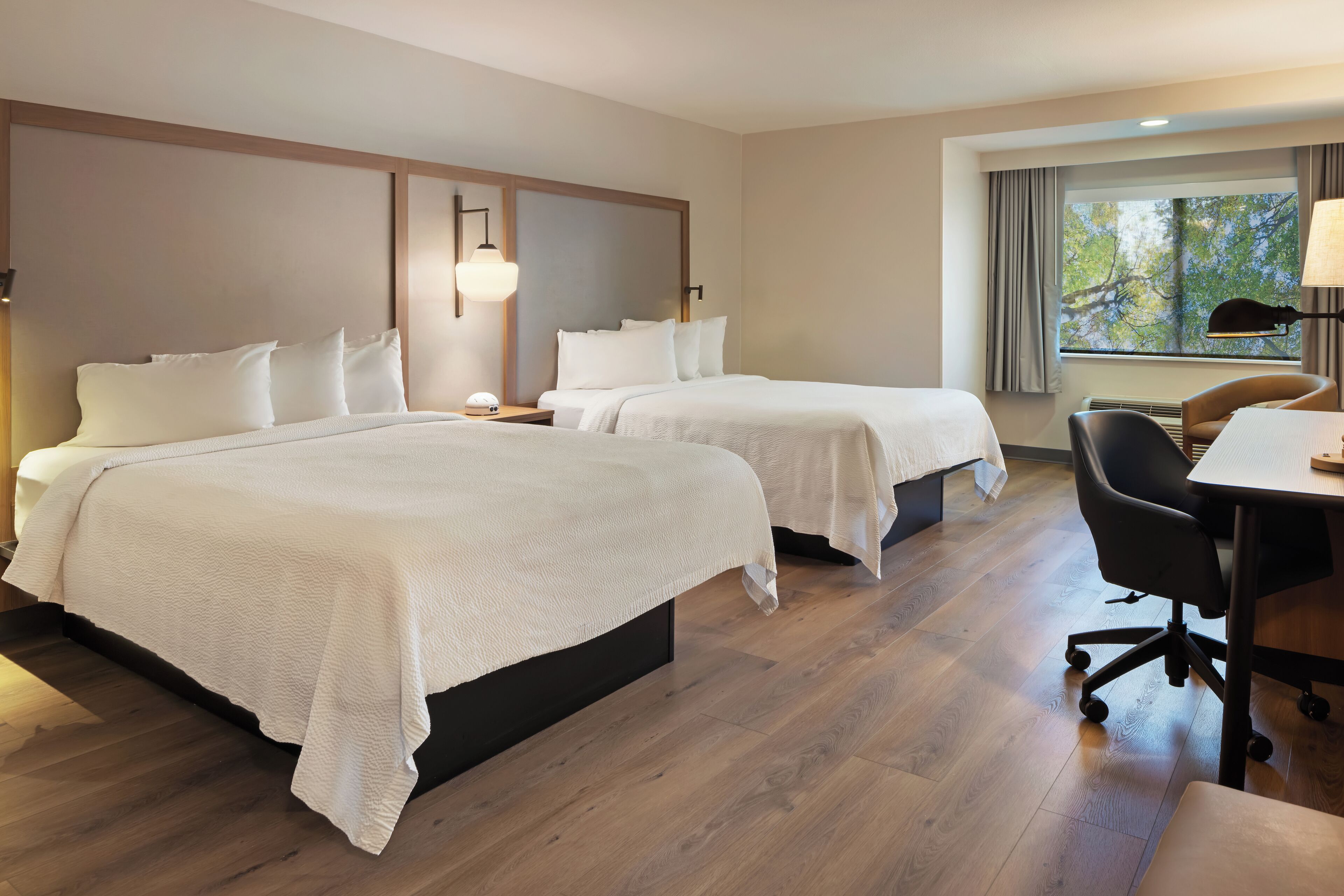 Premium bedding, desk, laptop workspace, iron/ironing board