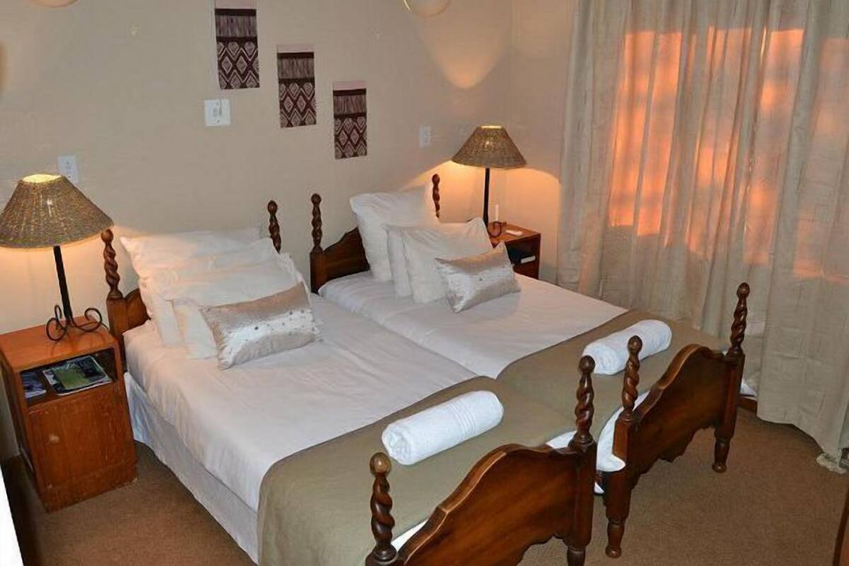 Deluxe-huone, näköala puutarhaan | Työpöytä, ilmaiset vauvansängyt