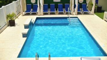 Outdoor pool, pool umbrellas, sun loungers