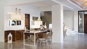 A spacious living area with a wooden desk, two chairs, a staircase, and a large window. - The 15th Boutique Hotel (Lloret de Mar)