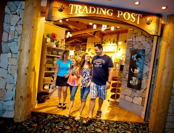 A Trading Post entrance with stone walls, wooden beams, and a sign above. - Great Wolf Lodge Niagara Falls (Niagara Falls)