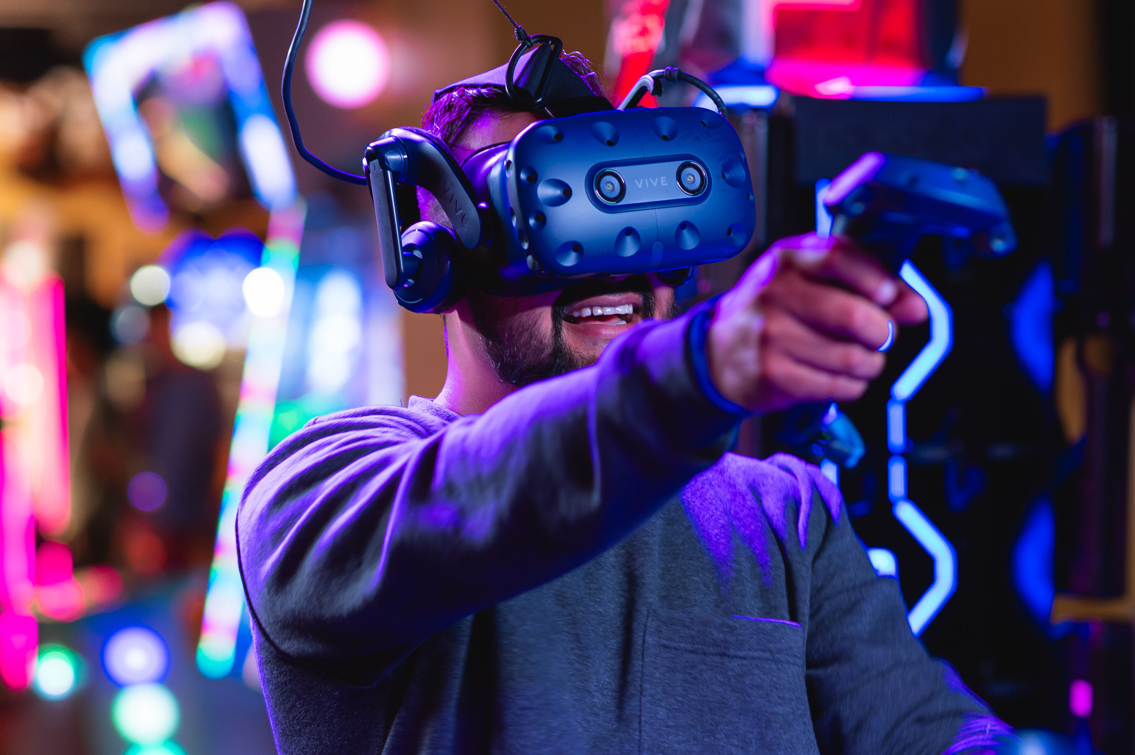A person wearing a VR headset holding a controller.
