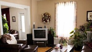 Penthouse ( Inn ) | Living area | TV - Dolan's Inn & Suites (Pictou)