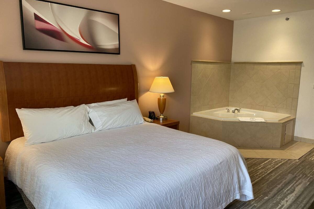 suite, one king bed | iron/ironing board, free cots/infant beds, rollaway beds, free wifi
