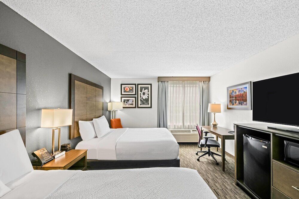 Premium bedding, desk, laptop workspace, iron/ironing board