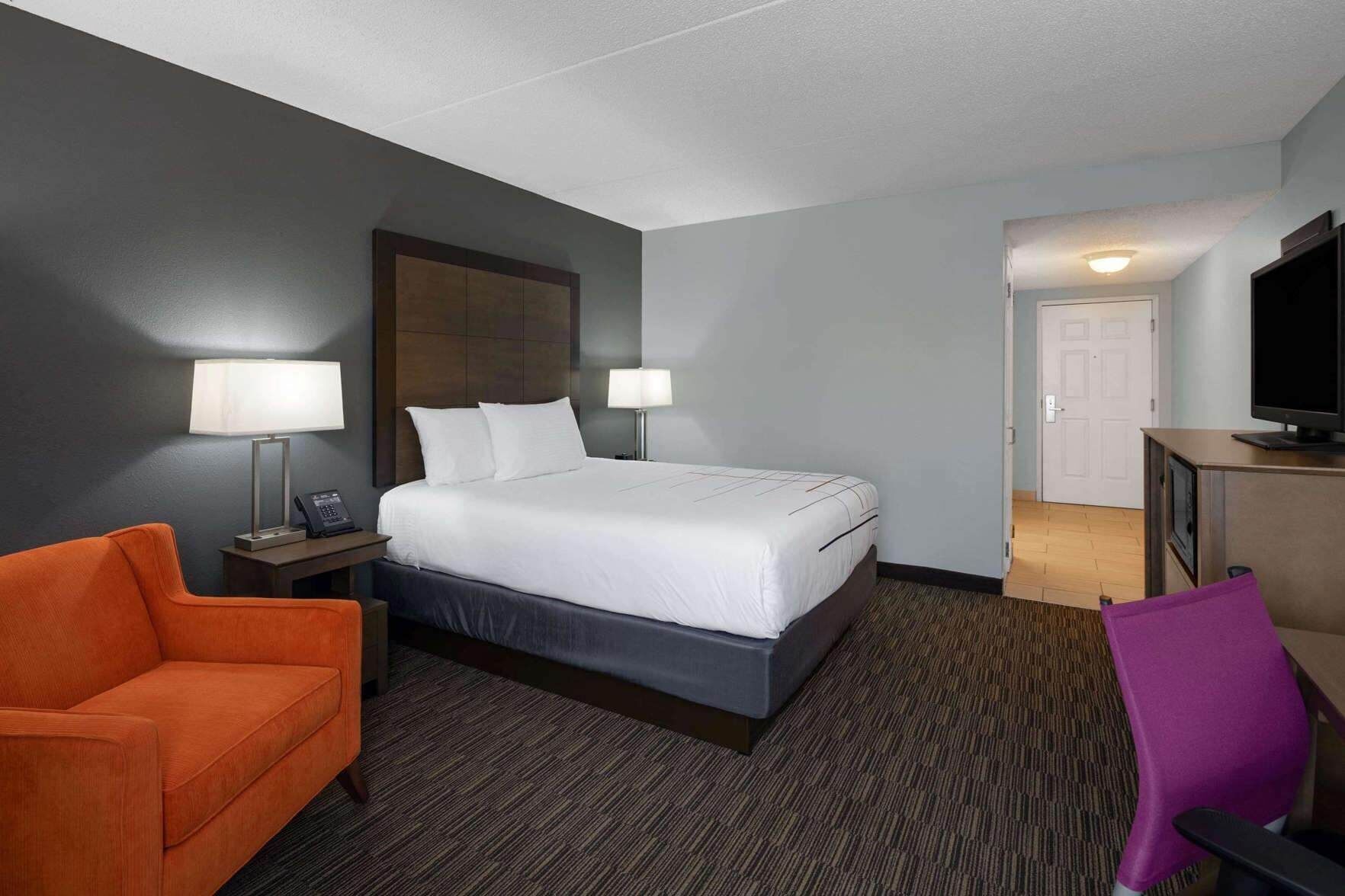Premium bedding, desk, laptop workspace, iron/ironing board