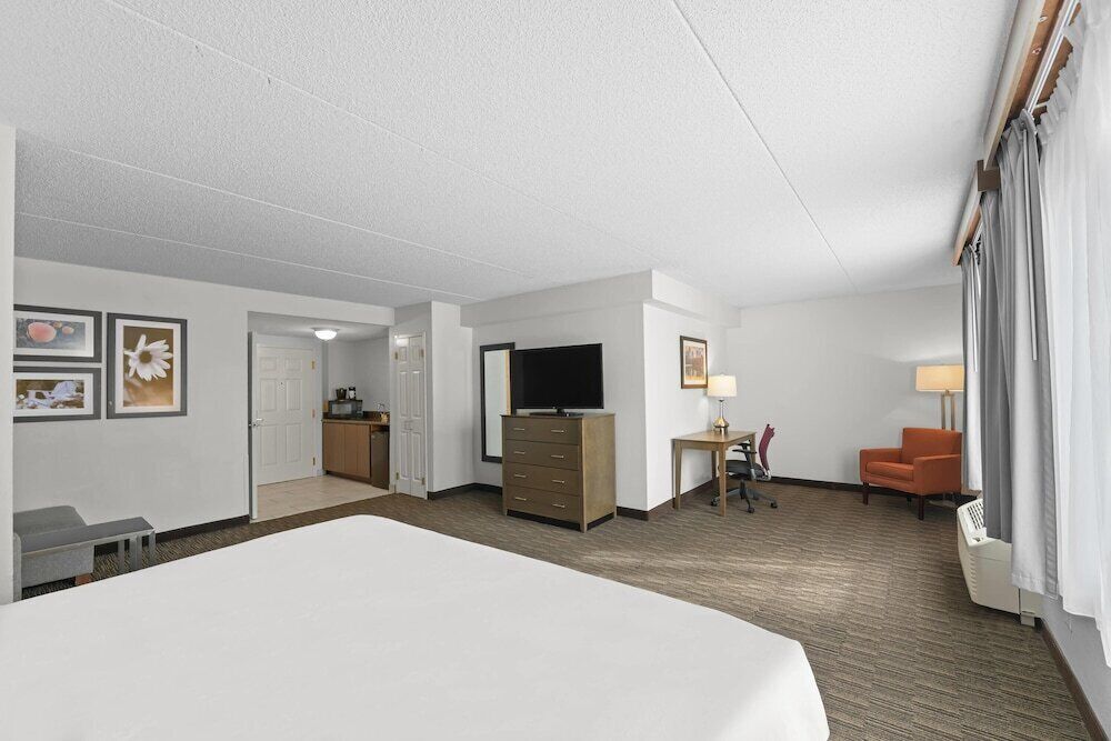 Premium bedding, desk, laptop workspace, iron/ironing board