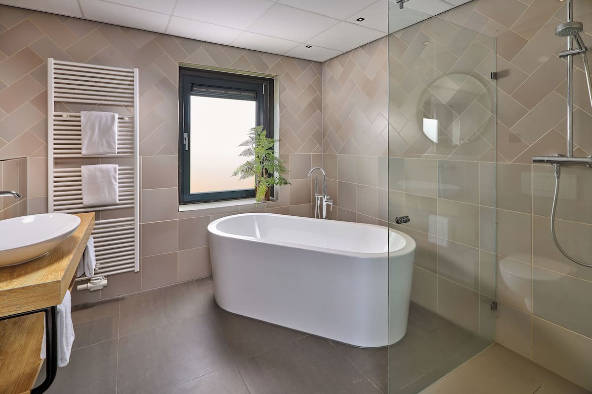 studio suite, 1 king bed | bathroom | free toiletries, hair dryer, towels, soap