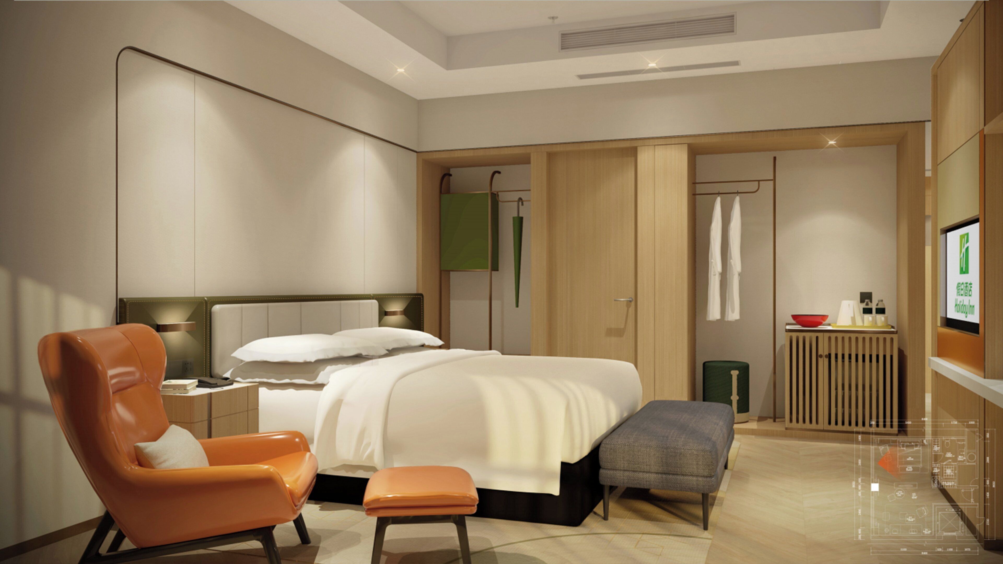 Una habitación de hotel moderna con cama, zona de estar, televisión y baño.