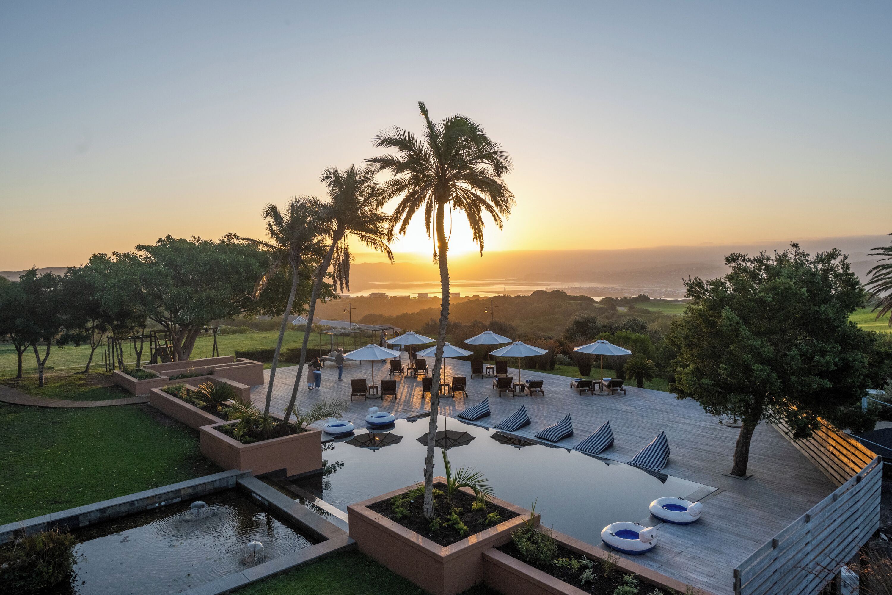 indoor pool, outdoor pool, pool umbrellas, pool loungers