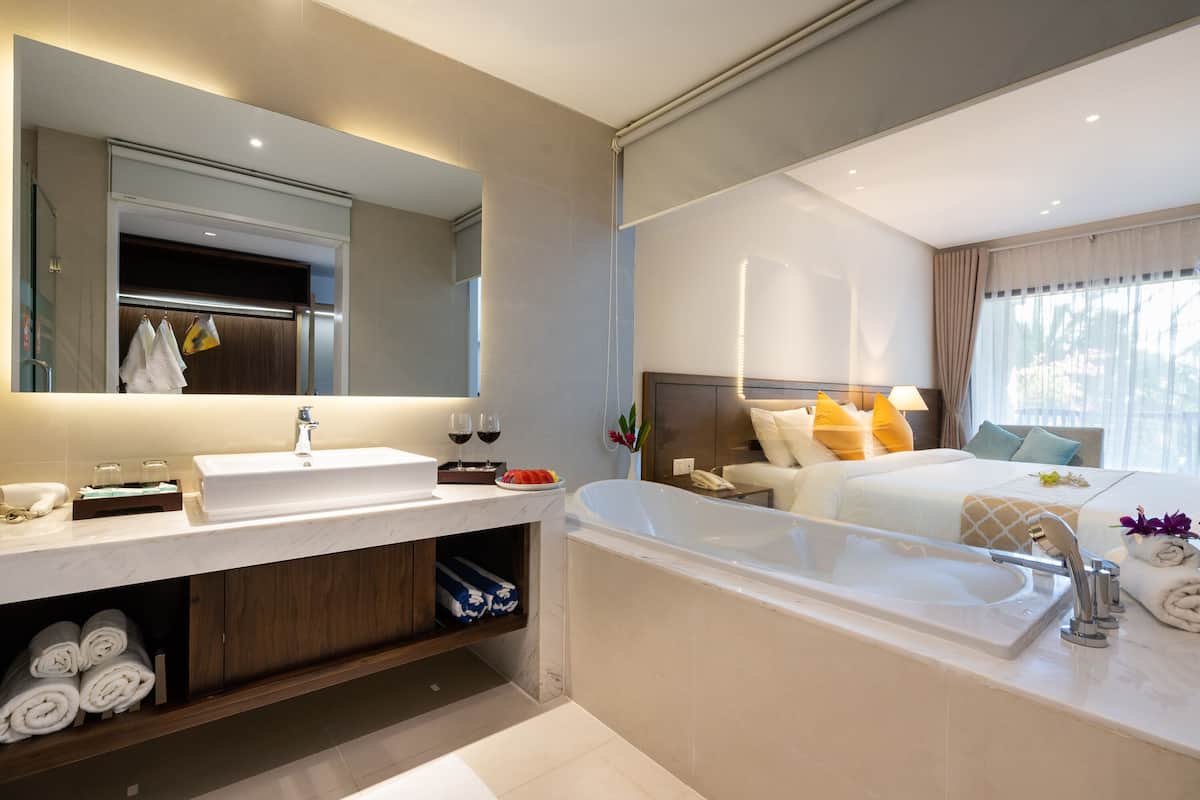 deluxe double bed room, garden view | bathroom | designer toiletries, hair dryer, bathrobes, slippers