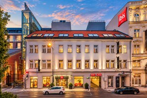 A hotel with a modern facade, multiple windows, and a red roof. - ibis Praha Old Town (Prague)