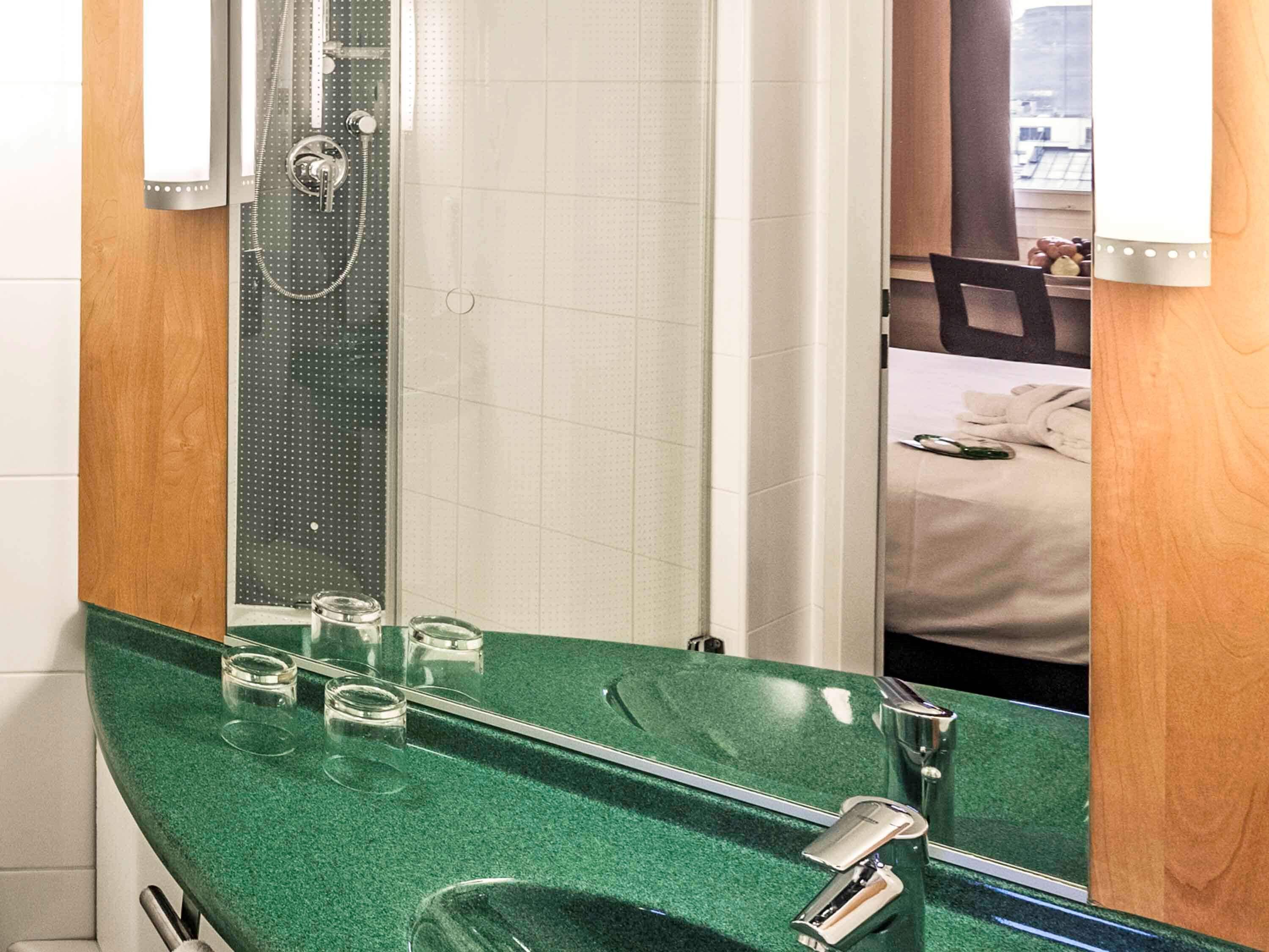 shower, eco-friendly toiletries, hair dryer, towels